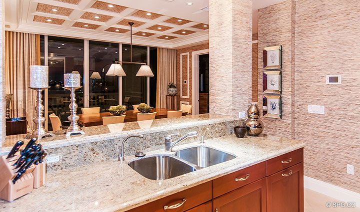 Kitchen and Dining Room in Residence 406 at Bellaria, Luxury Oceanfront Condominiums in Palm Beach, Florida 33480.