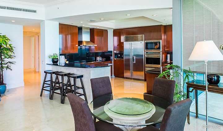 Dining Room and Kitchen inside Residence 902 For Rent at One Bal Harbour, Luxury Oceanfront Condos in Bal Harbour, Miami, Florida 33154.